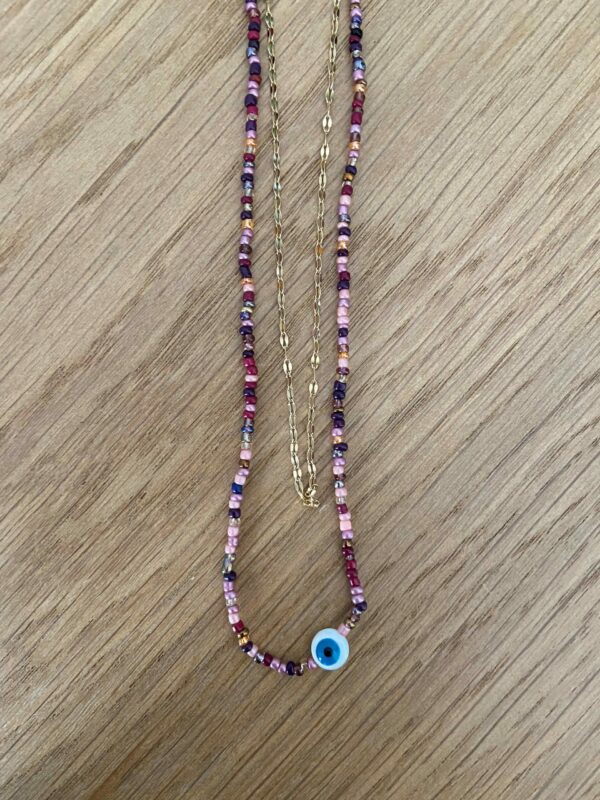 Collier double chaine avec perle et oeil